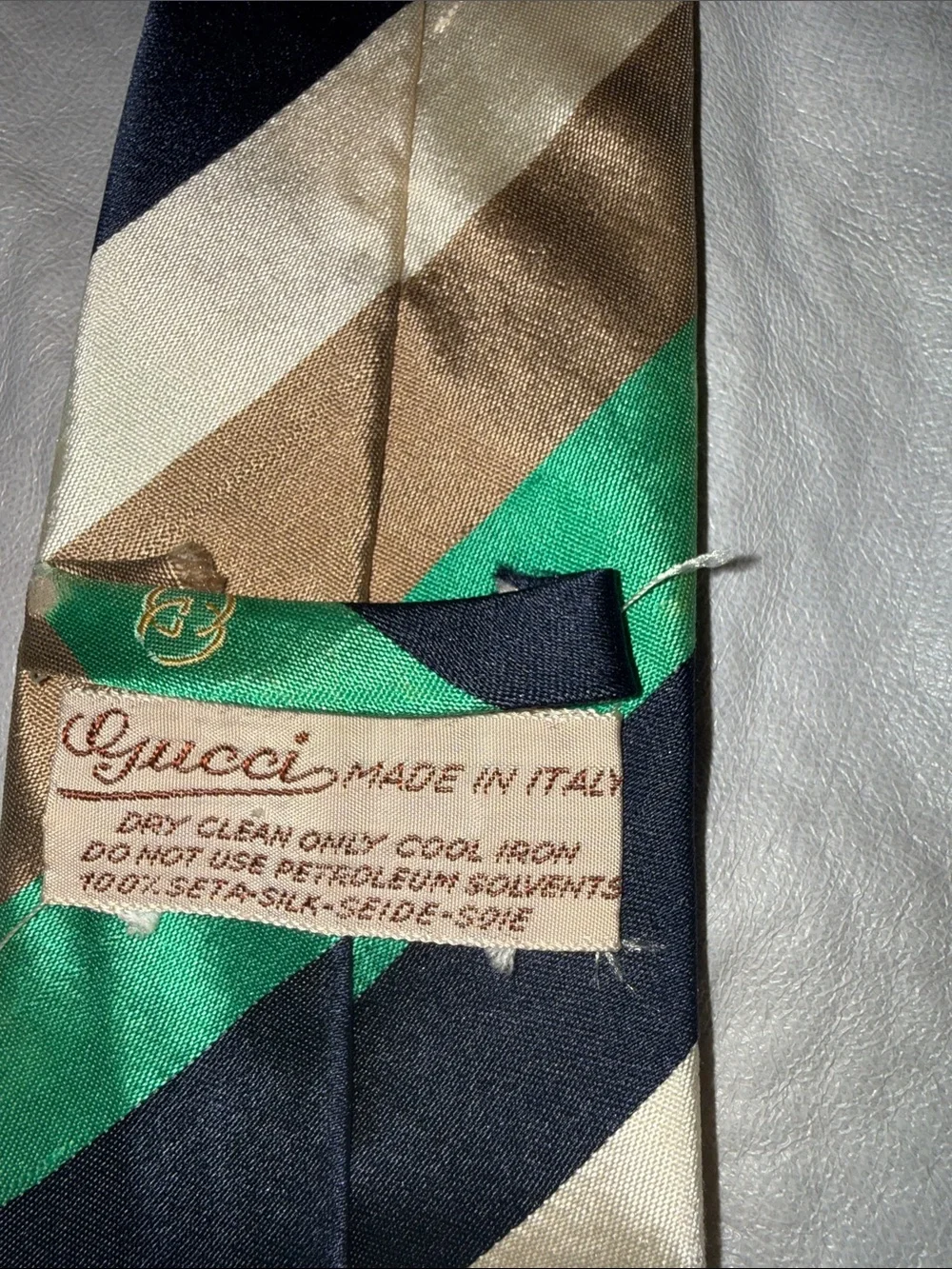 Vintage Gucci tie. Has frayed ends but overall clean and in good condition.
